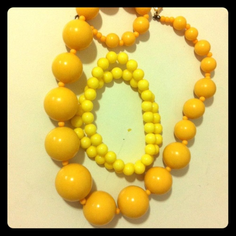 Yellow beaded bracelets(2) and necklace